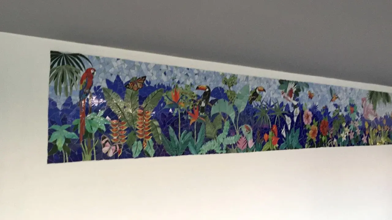 Nature-themed mosaic on the exterior wall of an Ahmedabad home