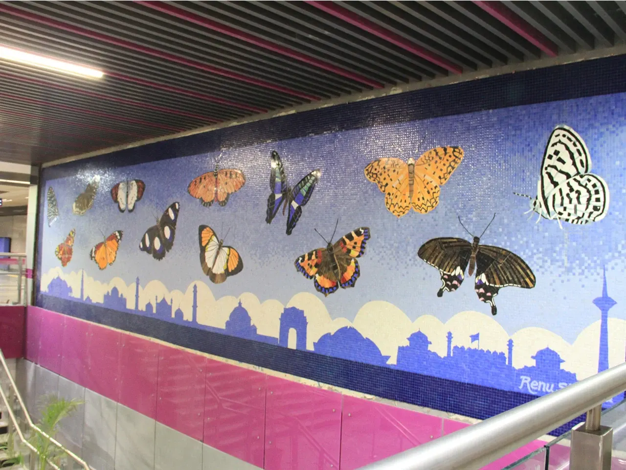 Hand-cut glass butterflies on the 400 sq ft Chirag Delhi metro mosaic mural